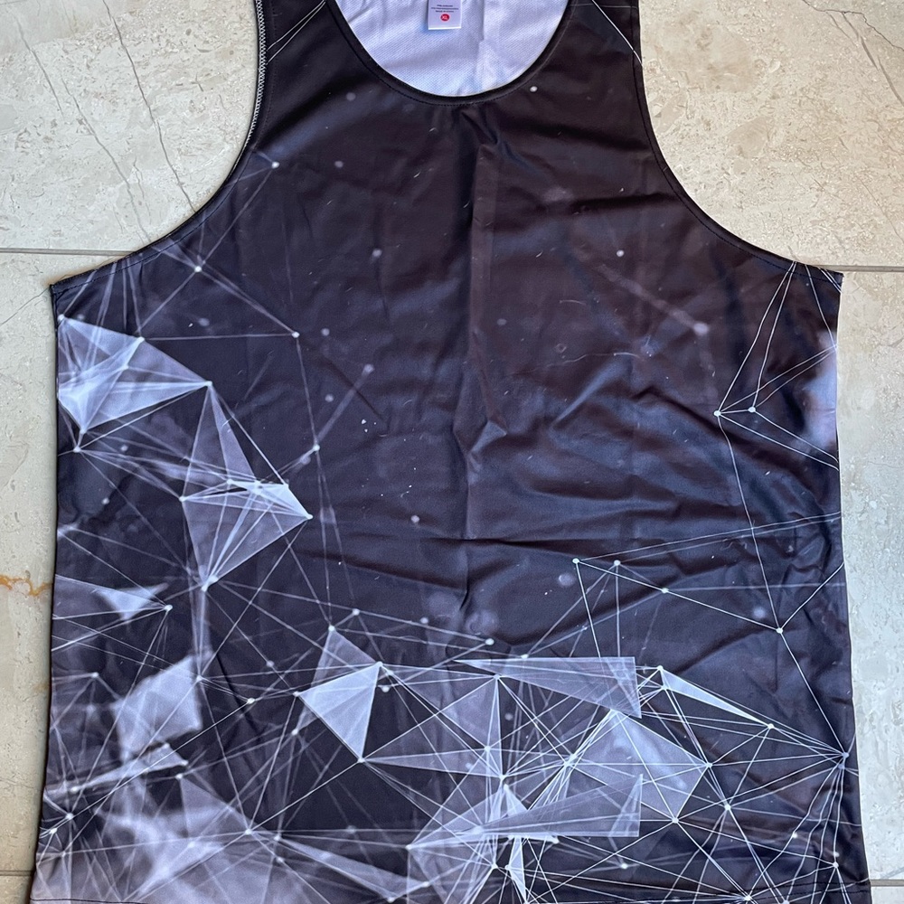 4 sleeveless shirts, material is polyester for $25. Brand new.